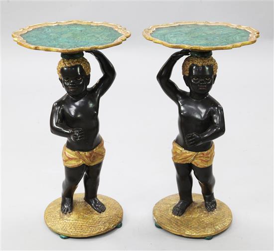 A pair of Venetian style ebonised and giltwood blackamoor occasional tables, W.1ft 3in. H.2ft 2in.